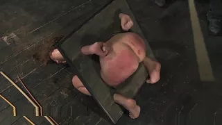 Rain DeGrey Crying While Caned in a Bondage Device