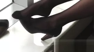 #64 black stockings on window seat