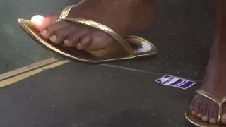 Sexy ebony feet in gold flip flops pt.2