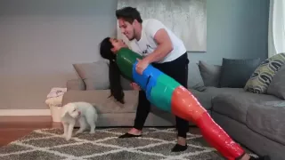 Girl is mummified in multi-colored duct tape and can't get loose