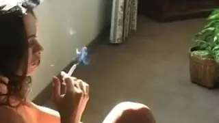 Curvy Perfection Relishes A Relaxing Smoke In Nature's Garb