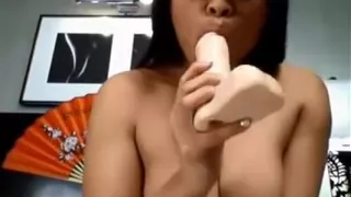 Asian Teen Nerd Sucks A Dildo