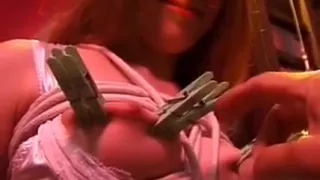 Tied Up Redhead Wearing Lingerie In A Dungeon