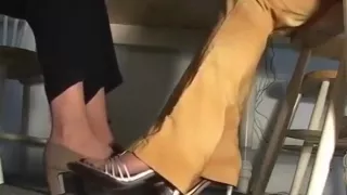 Girls play footsie and compare