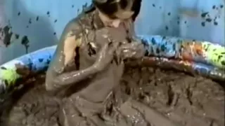 2 girls in mud bath