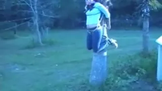 Jordan tied to palm tree