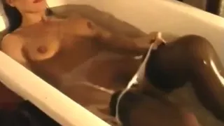 Woman takes bath fully Clothed