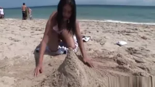 My asian girl playing on the beach