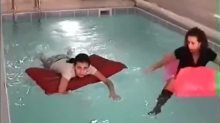 Skirts and Boots Swimming in Pool