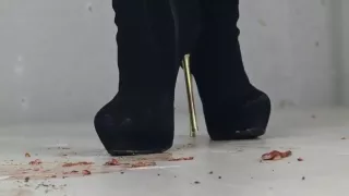 Bethany crushing worms under high heeled boots.
