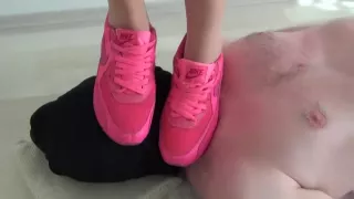 trampling in pink nike sneakers