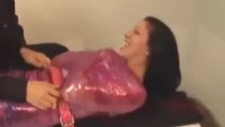 Extremely ticklish wrapped girl