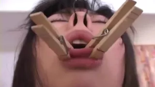 Asian brunette getting roped up and tongue pegged