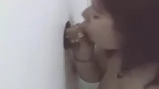 Chubby Brunette Taking Facial Cumshot Through Glory Hole