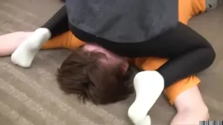 Slim teen facesitting in shiny leggings