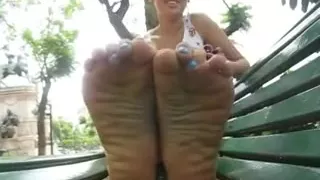 Latin Girl Shows Off Her Feet Outdoors