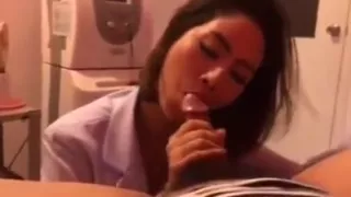 junior thai doctor in her clinic