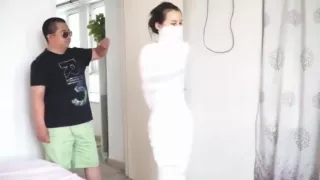 Asian girl mummified and hopping