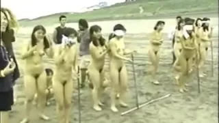 japanese nude girls splitting a watermelon with a stick while blindfolded