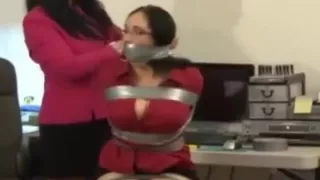 sexy women wrap gagged in the chair by Gina Rae Michaels