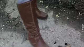 woman crush bugs boots