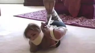 Massively gagged girl struggled in barefoot hogtie