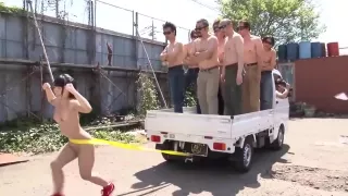 Fit Japanese girl flexes and shows off her strength outdoors