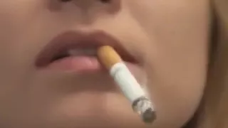 Pretty girl smoking very close-up lips and nails