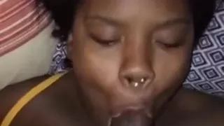 Young ebony enjoying a throat massage