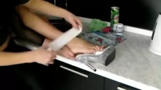 Two Girls Damaging and Bandaging Each Other's Foot in the Kitchen