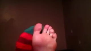 Fuzzy Christmas Socks and Bare feet