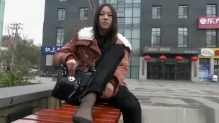 Beautiful Teenager Black Nylon Soles Sitting On A Bench