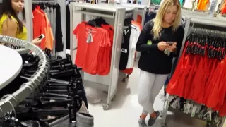 Candid voyeur hot blonde in leggings shopping