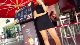 Candid voyeur thick blonde hostess in tight black dress