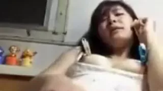 Girl masturbating in her room .