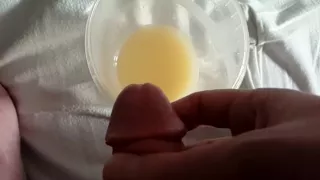Slow Motion cum into cup full of cum
