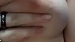 Touching my hard nipples.