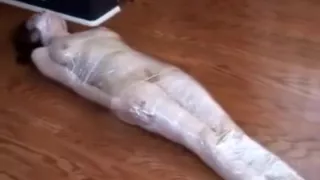Plasticwrapped mummified girl