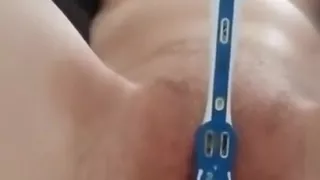 Dakota enjoys playing with a toothbrush