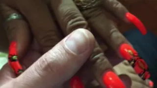 Latina with sexy long orange(different design) nails
