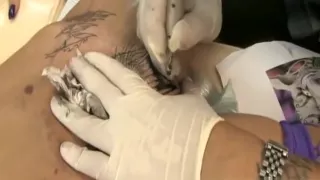 Tabitha gets a tattoo in her pussy