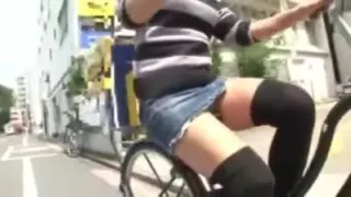 Japanese girl rides a bike with short skirt in streets