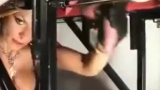 Using his hanging cock and balls as a punchbag
