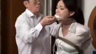 Chinese police woman tied up