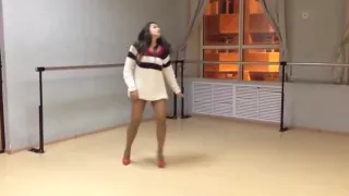 Girl in extremly short dress and high heels dancing