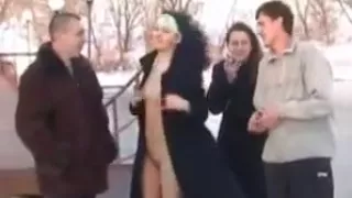 Two girls flashing in the snow