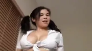 Sexy schoolgirl Mia sets her big boobs free and plays with a huge toy