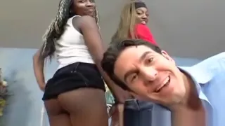 Busty black teens tag team a white cock in an interracial threesome