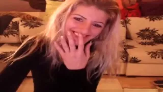 Smoking blonde stripteasing and having fun on webcam