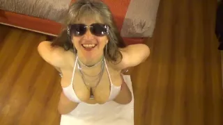 Tinja stretches a white string bikini in 6 inch stilettos